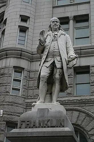 Marble statue of a standing man