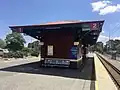 Small maroon brick platform shelter