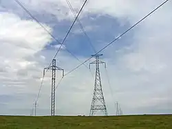 The only crossing of two different HVDC overhead powerlines in the Western hemisphere, CU ( small pylons) and Square Butte ( large pylons) in North Dakota