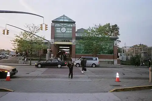 Commuters transfer from train to bus