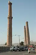 Traffic passing on road near the Herat minarets, 2005.