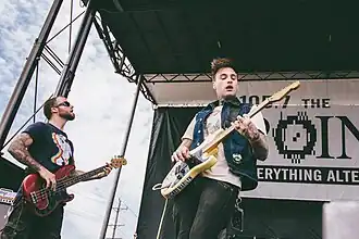 Frontman Johnny Stevens (right) and bass player Rich Meyer (left) performing at Pointfest 33 at Hollywood Casino Amphitheatre in St. Louis, May 2015