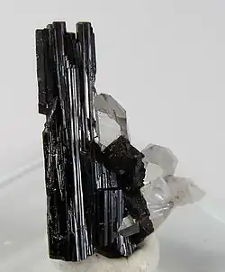 Image 9Hübnerite, the manganese-rich end-member of the wolframite series, with minor quartz in the background (from Mineral)