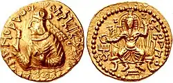 Kushan ruler Huvishka with seated god Serapis ("Sarapo") wearing the modius, 2nd century CE.[21]
