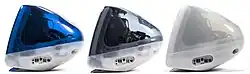 Side view arrangement of dark blue, gray, and white iMacs.