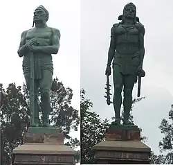 Two bronze statues of two pre-Hispanic men.