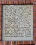 Inscription to the left of the entrance