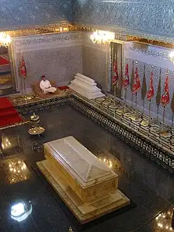 Interior of the mausoleum with a Quran reader