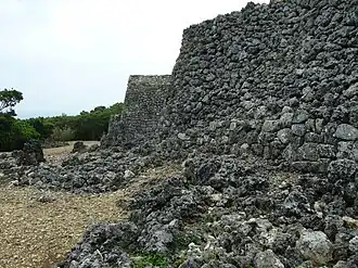 The cobbled walls of a stone castle