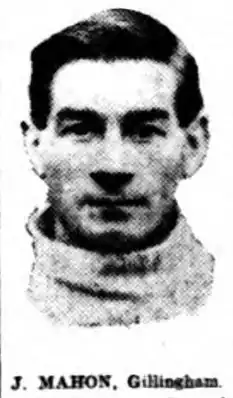Grainy black and white photograph of a dark-haired young man in a football shirt