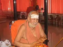 a seer in a seated posture
