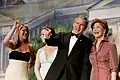 President George W. Bush points out members of the audience to First Lady Laura Bush during the "Black Tie and Boots Inaugural Ball" in Washington, D.C held on January 19, 2005.