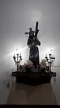 Jesus of the Great Power held up on an altar