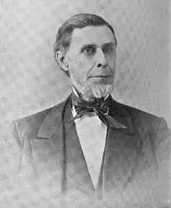 Black and white 1896 head and shoulders photo of John L. Edwards in suit and tie, facing front, looking slightly to his left