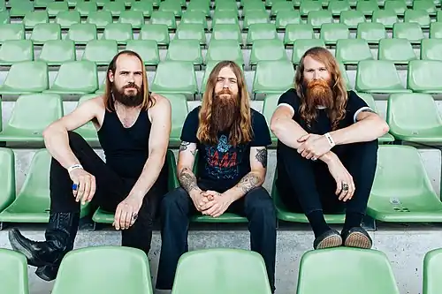 Image 14 Kadavar Photograph: Henry W. Laurisch Kadavar are a rock band from Berlin, Germany, founded in 2010. Their retro sound, incorporating psychedelic rock and stoner rock, has been compared to bands of the 1970s hard rock/heavy metal era. Kadavar currently consists of three members: guitarist and lead vocalist Christoph "Lupus" Lindemann, drummer Christoph "Tiger" Bartelt, and bassist Simon "Dragon" Bouteloup.
