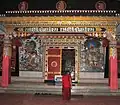 Nyingma Tibetan Buddhist temple with decorative use of the Lantsa variant of Rañjanā .