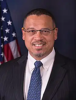 Head shot of Ellison smiling