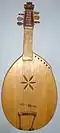 Veresai Bandura often referred to as a kobza - a Ukrainian Lute-like instrument, described by Mykola Lysenko from Ostap Veresay - Ukrainian blind epic singer approx. in 1871