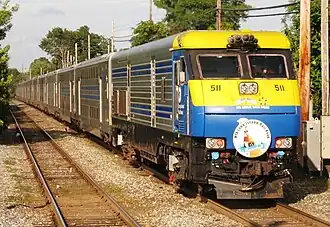 The Cannonball, with DM30AC #511 trailing and bearing the train's drumhead, passing through Bay Shore station