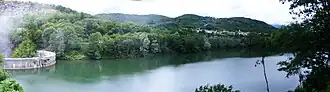 A body of water with visible greenery around.