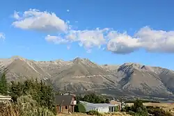 Lake Ohau Alpine Village in summer (with the Ōhau Ski Field in the background; Feb 2018)