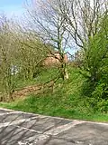 The remains of the wooden pedestrian footbridge and way up to the station