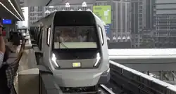 MRT train entering the Phileo Damansara MRT station platform.