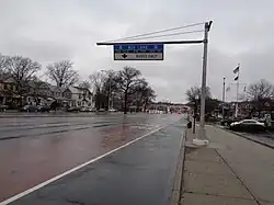 Offset, red-painted bus lane on Woodhaven Boulevard, north of Metropolitan Avenue, in Queens