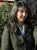 A woman wearing a suit