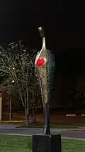“Angel” - Dedication to the Donor. 2021, h = 400 cm, bronze, dynamic lighting – Minsk Center for Surgery and Transplantology (nighttime general view)
