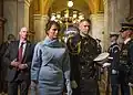 Melania Trump is escorted by a White House social aide at the United States Capitol in 2017