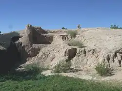 The Temple Mound. Built by the Hohokam in 1100 AD. The walls are made of “caliche”, the calcium carbonate hardpan that forms under the desert soils. The mound is longer and wider than a modern football field (note: U.S. Football) and is 27 feet high.