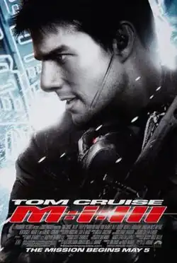 A portrait view of Tom Cruise's Ethan Hunt equipped with tactical body armor, an earpiece, and a rifle. All color is desaturated, with the exception of red and blue.