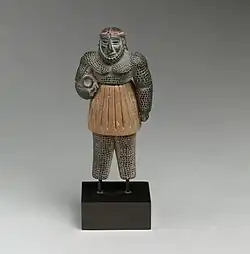 Male figure; late 3rd–early 2nd millennium BC; chlorite, calcite, gold and iron; height: 10.1 cm; Metropolitan Museum of Art