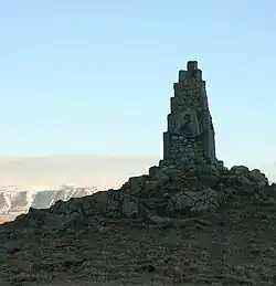 Monument to Stephan G. Stephanson. It is made from many small rocks on top of a rocky hill
