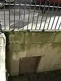 Coal hole and doorway under street