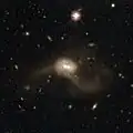 Mrk 463 in wide view with legacy surveys, showing the tidal arms