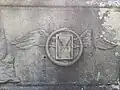 Bas-relief with winged clessidra and ouroboros