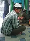 Raising hands in Dua.