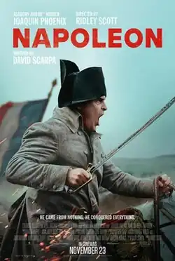 Napoleon Bonaparte rides on horseback wielding a sabre.