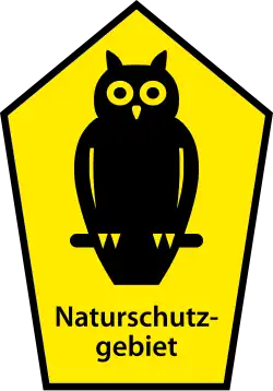 Owl on pentagonal sign