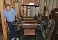Don Ofe, the Site Administrator of the Neligh Mill, explains how a roller mill from 1888 grinds the wheat into flour.