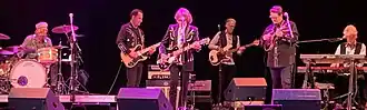 A photo of the Nitty Gritty Dirt Band performing on stage.