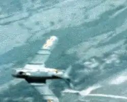 Blurry Gun camera photo shows a North Vietnamese MiG-17-fighter.