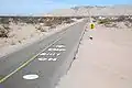 Road markings south of the dip with the vado to the north beyond on Fed. 5.[clarification needed]