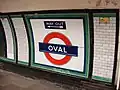 Station roundel with a direction of the way out