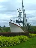 A landmark at the intersection of Federal Route 53 and the Seremban-Port Dickson Highway, near Lukut. The sign translates to "Welcome to Port Dickson".