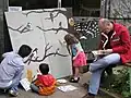 Collaborating on a bird canvas on an Open Day