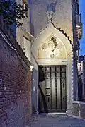 The entrance decorated with the Van Axel coat of arms