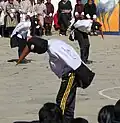 Children dressed in costume resembling the Black-necked crane dance the famous Black-necked crane dance